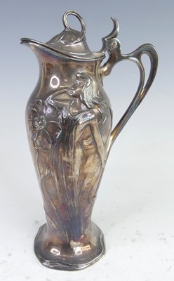 Lot 150 - An Art Nouveau pewter lidded jug, having...