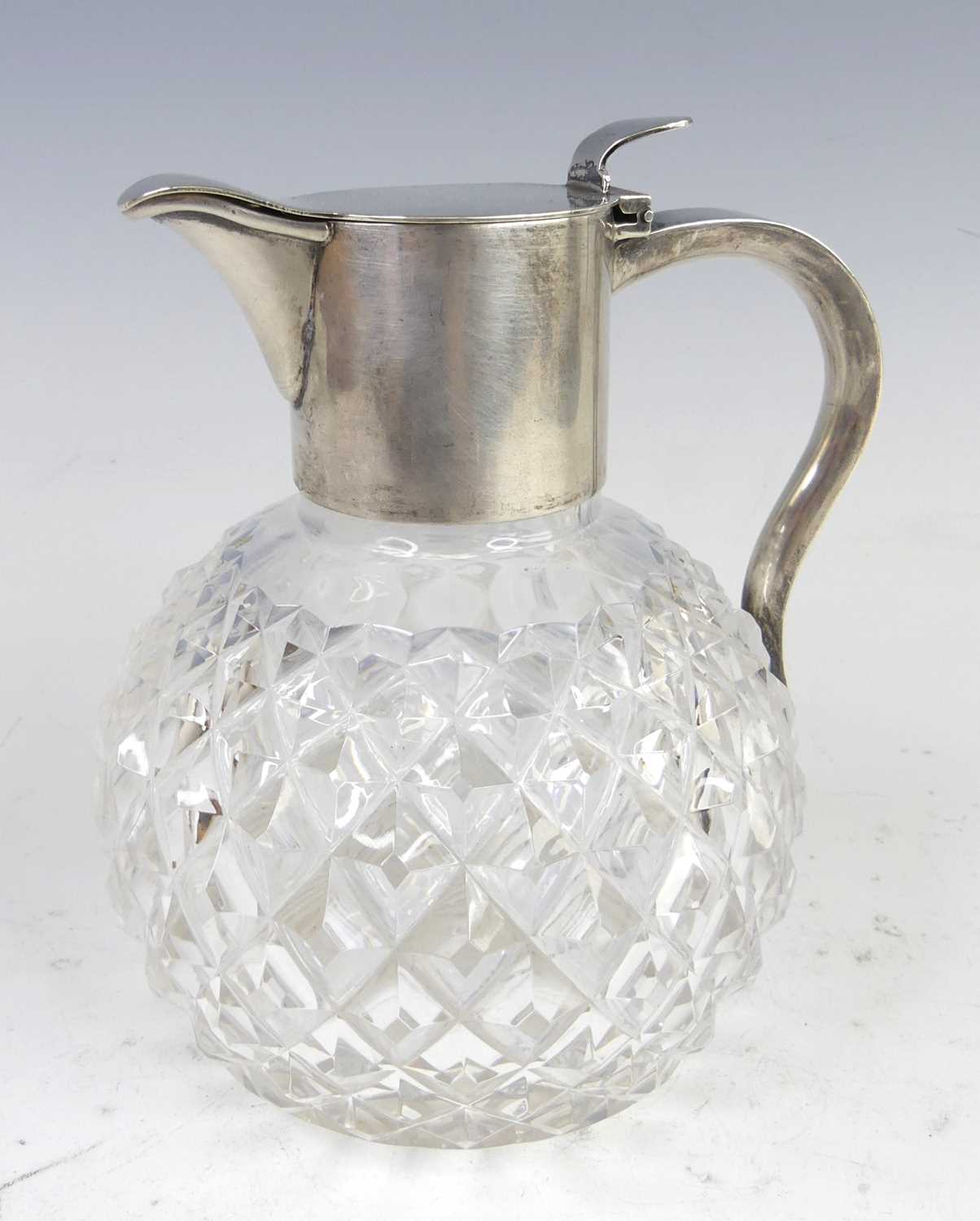 Lot 94 - A circa 1900 silver and glass bodied claret...