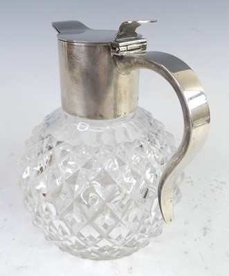 Lot 94 - A circa 1900 silver and glass bodied claret...