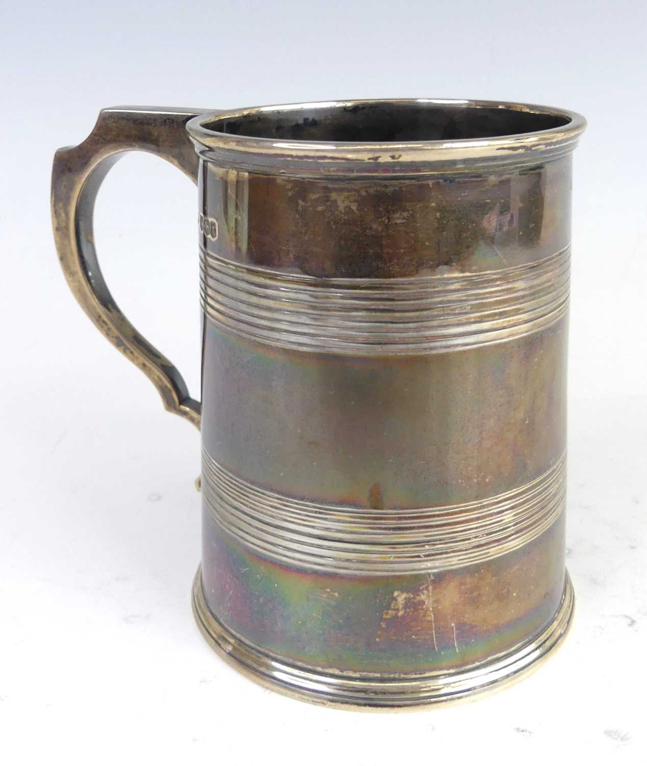 Lot 96 - An Art Deco silver tankard, of slightly...