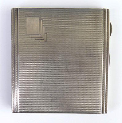 Lot 98 - An Art Deco silver engine turned pocket...