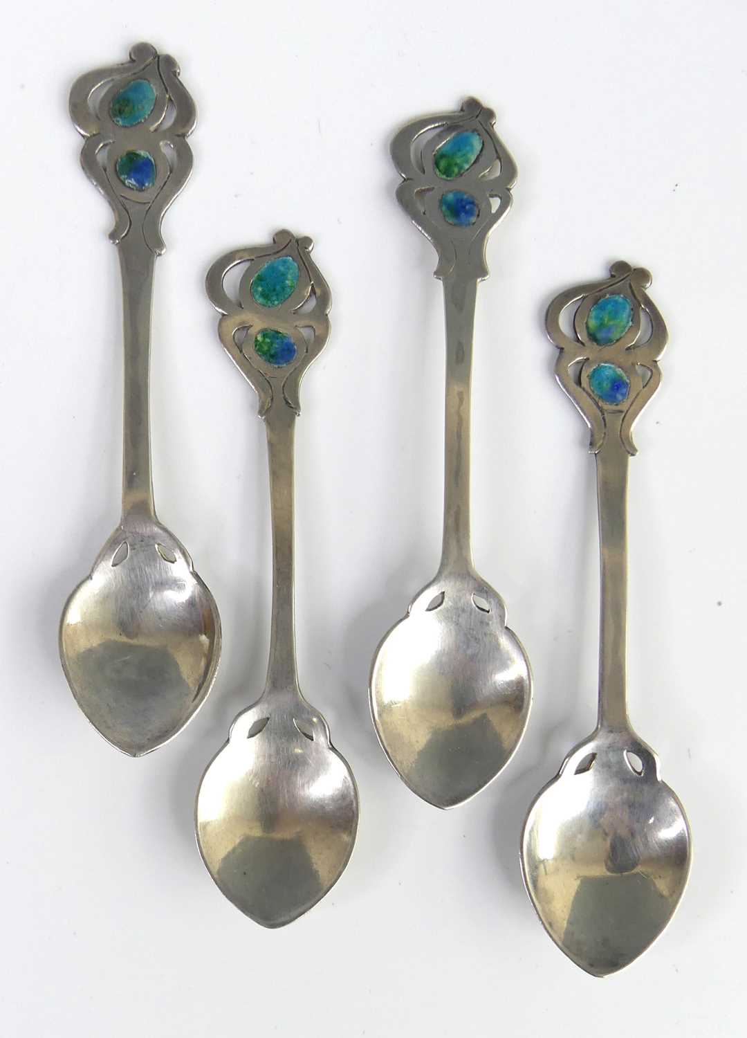 Lot 90 - A set of four Arts & Crafts white metal and...