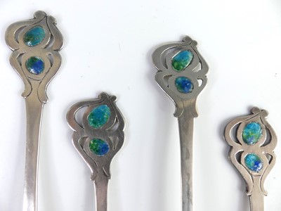 Lot 90 - A set of four Arts & Crafts white metal and...