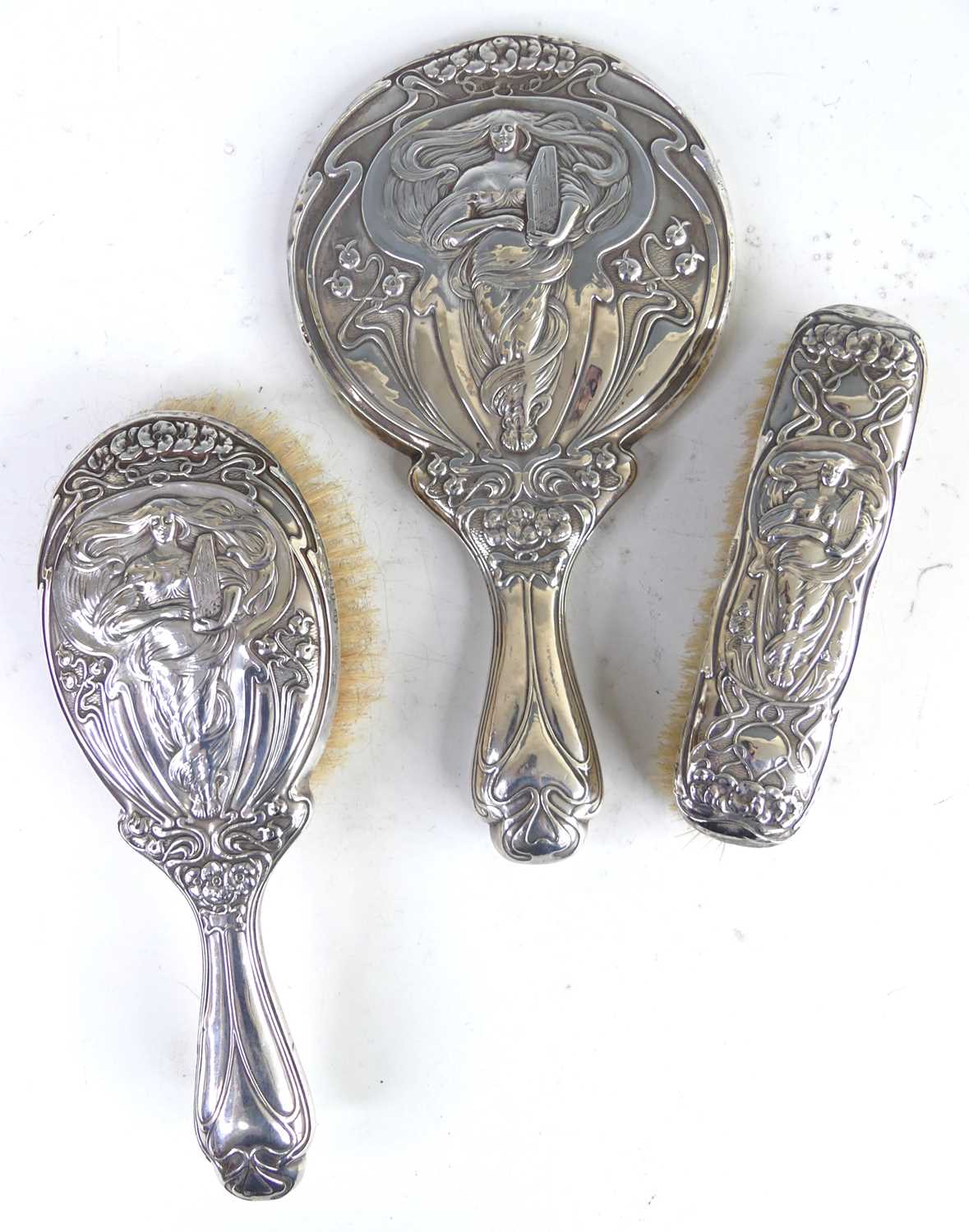 Lot 89 - An Art Nouveau silver-clad three-piece...