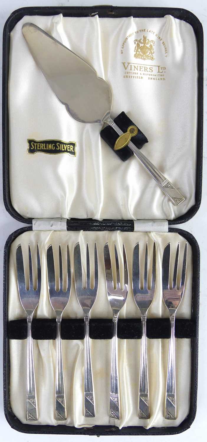 Lot 93 - A cased set of six silver cake forks with...