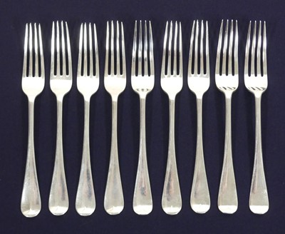 Lot 167 - A matched set of nine silver table forks, in...