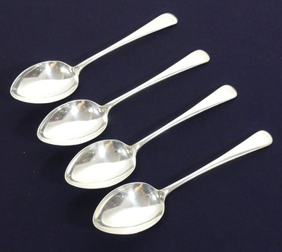 Lot 172 - A set of four George V silver table spoons, in...