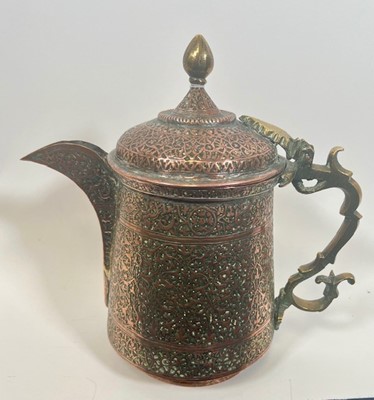 Lot 41 - A Kashmir Copper and Brass ewer, with tinned...
