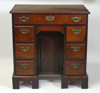 Lot 2527 - An early George III mahogany kneehole writing...