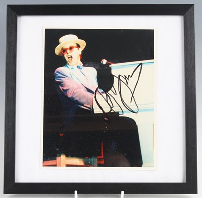 Lot 1325 - Elton John, a 25.5 x 20cm colour image of...