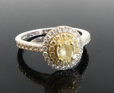 Lot 2335 - An 18ct white and yellow gold fancy yellow...