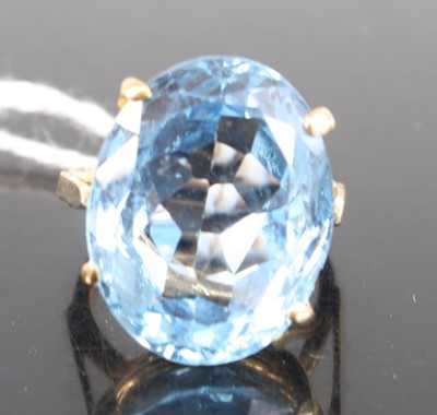 Lot 315 - A 9ct yellow gold blue topaz single stone ring,...