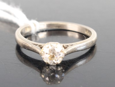 Lot 314 - An 18ct white gold solitaire ring with a badly...