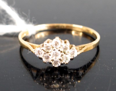 Lot 281 - A yellow and white metal navette cluster ring...