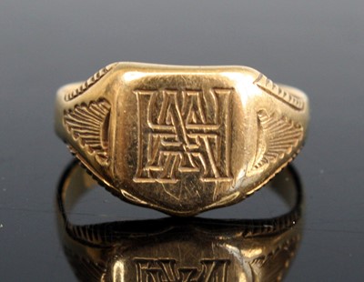 Lot 282 - A yellow metal shield-shaped signet ring...