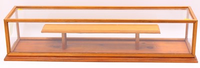 Lot 2071 - A pine and glazed wooden display case, with...