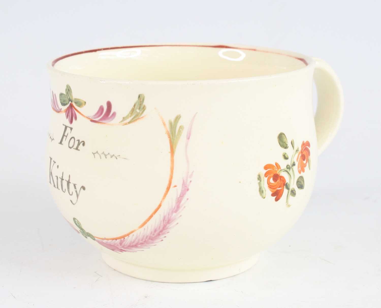 Lot 2050 - A late 18th century creamware mug, decorated...