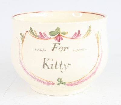 Lot 2050 - A late 18th century creamware mug, decorated...