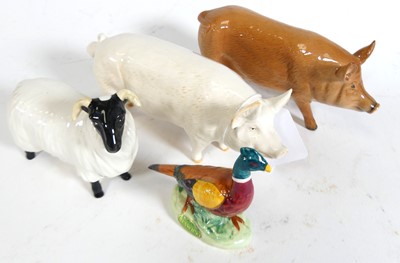 Lot 122 - A collection of animal figures to include a...