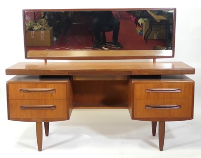 Lot 408 - A 1960s G-Plan 'Fresco' teak kneehole long...