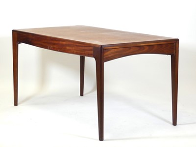 Lot 443 - A 1960s teak extending dining table, of plain...