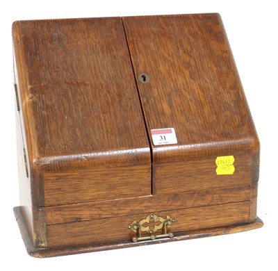 Lot 31 - An Edwardian oak table top stationery cabinet,...