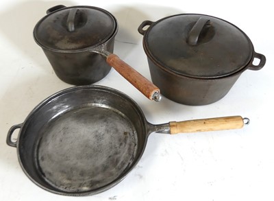 Lot 64 - Cast iron cooking wares to include a 10''...