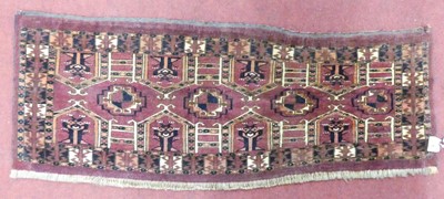 Lot 1184 - A Persian woollen Tekke bagface, 37 x 95cm