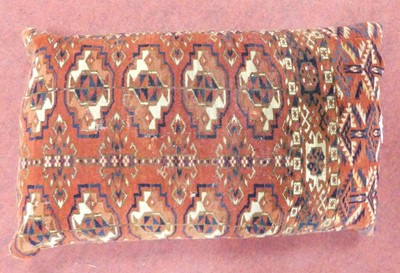 Lot 1199 - Three cushions, two made from Afghan carpet...