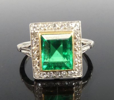 Lot 2331 - A white and yellow metal, emerald and diamond...