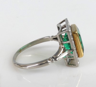 Lot 2331 - A white and yellow metal, emerald and diamond...