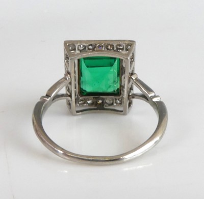 Lot 2331 - A white and yellow metal, emerald and diamond...