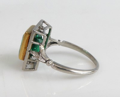 Lot 2331 - A white and yellow metal, emerald and diamond...
