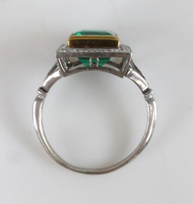 Lot 2331 - A white and yellow metal, emerald and diamond...