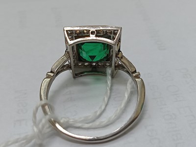 Lot 2331 - A white and yellow metal, emerald and diamond...