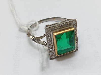 Lot 2331 - A white and yellow metal, emerald and diamond...