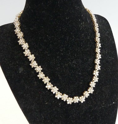 Lot 2318 - A yellow and white metal diamond articulated...