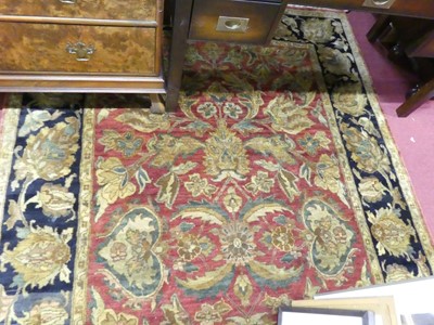 Lot 1161 - A Persian woollen Agra rug, having a red...