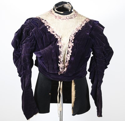 Lot 468 - A circa 1900 purple velvet gown, the bodice...