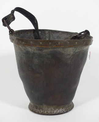 Lot 29 - An early 20th century riveted leather fire...