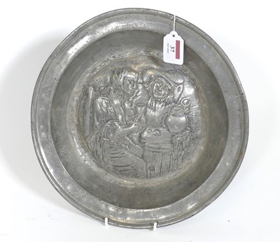 Lot 37 - A Dutch pewter dish, repousse decorated with...