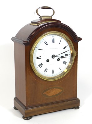 Lot 38 - An Edwardian walnut cased dome topped mantel...