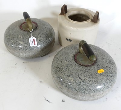 Lot 65 - A pair of polished granite curling stones;...