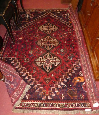 Lot 1170 - A Persian woollen Qashqai rug, decorated with...