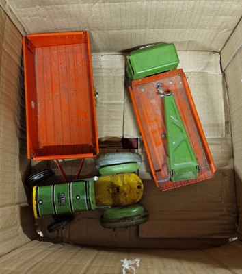 Lot 1596 - A Mettoy tin plate tractor and trailer...