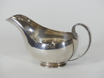Lot 190 - A George VI silver sauceboat, of helmet shape,...