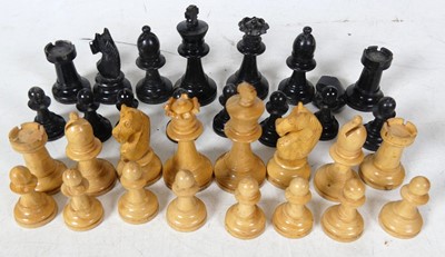Lot 224 - A boxwood and ebonised wooden chess set, king...