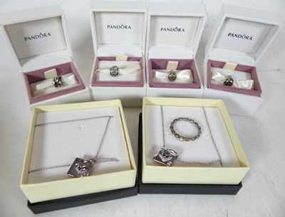 Lot 236 - A collection of Pandora charms, together with...