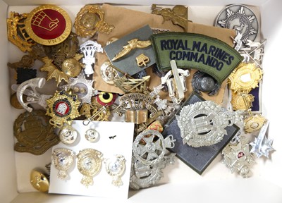 Lot 237 - A collection of military cap badges, buttons,...