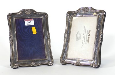 Lot 205 - A pair of silver clad easel photograph frames,...